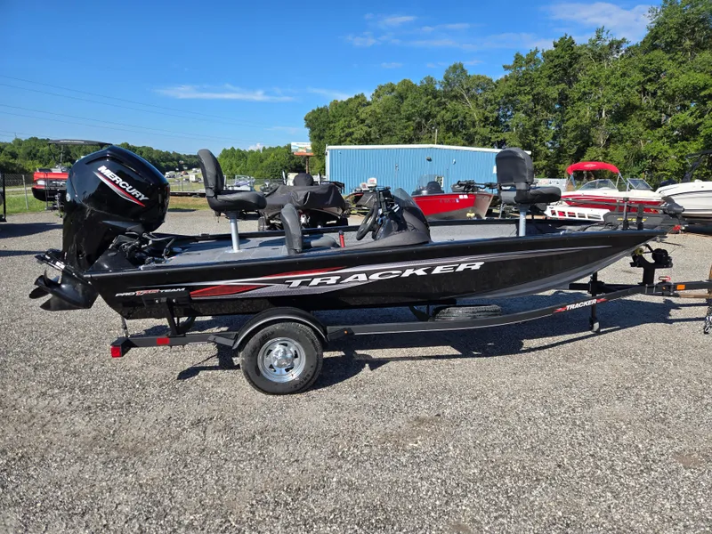 Slide: The Image of 2023 Tracker Pro Team 175 TF boat on trailer, outdoors, sunny day. - 3