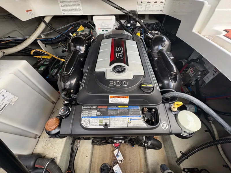Slide: The Image of Engine compartment of a 2019 Crownline 264 CR boat with Mercury 6.2L engine. - 16