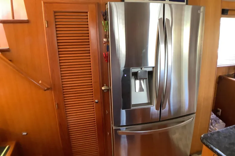 Slide: The Image of Stainless steel refrigerator in 1998 Grand Alaskan 60 Pilothouse interior. - 21