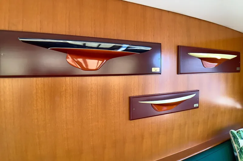 Slide: The Image of Wall-mounted ship models on a wooden panel, Grand Alaskan 60 Pilothouse, 1998. - 26