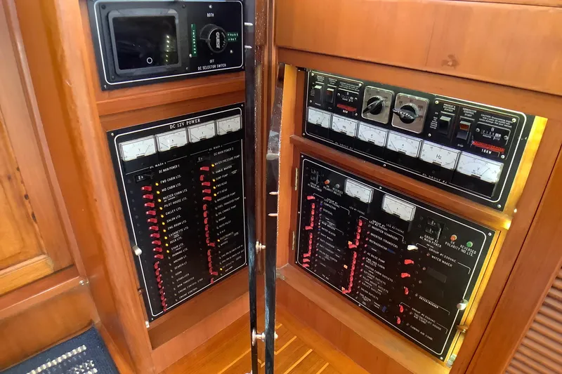 Slide: The Image of Electrical control panel on a 1998 Grand Alaskan 60 Pilothouse yacht. - 28