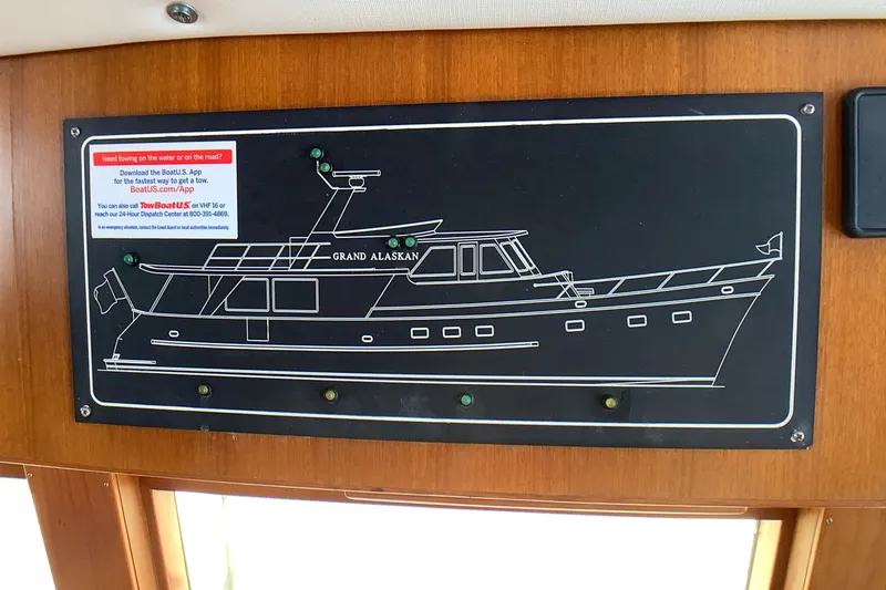 Slide: The Image of Diagram of a 1998 Grand Alaskan 60 Pilothouse yacht on a wooden panel. - 29
