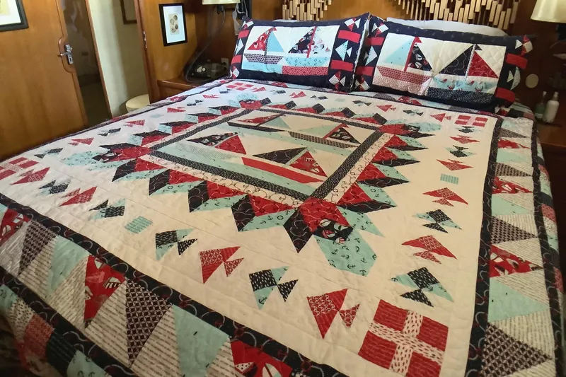 Slide: The Image of Colorful geometric quilt on bed inside 1998 Grand Alaskan 60 Pilothouse yacht. - 33