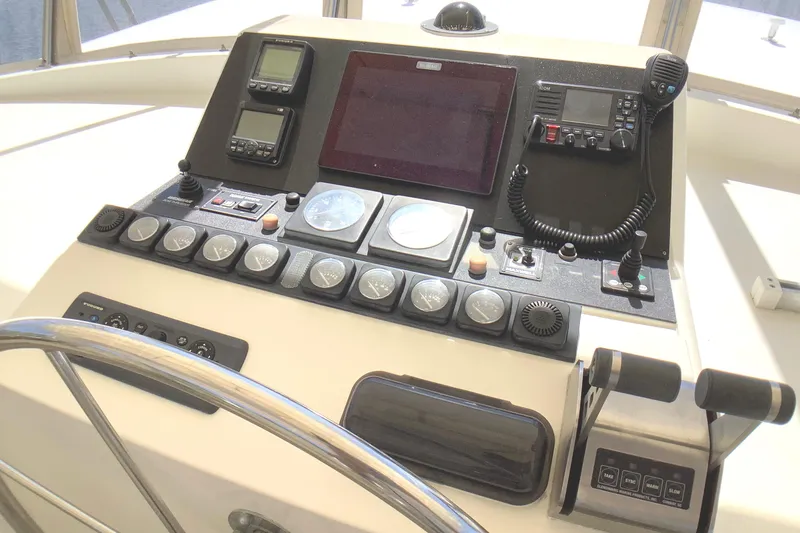 Slide: The Image of Control panel of a 1998 Grand Alaskan 60 Pilothouse yacht with navigation instruments. - 41