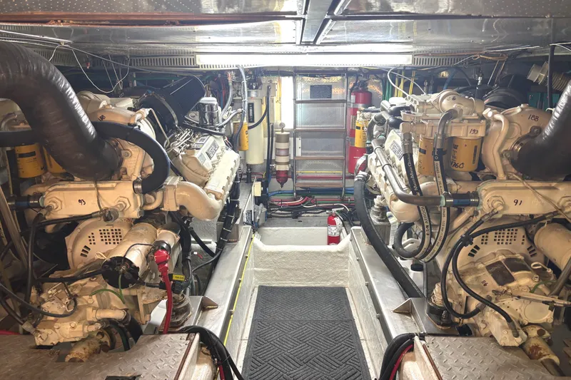Slide: The Image of Engine room of 1998 Grand Alaskan 60 Pilothouse with dual engines and equipment. - 47