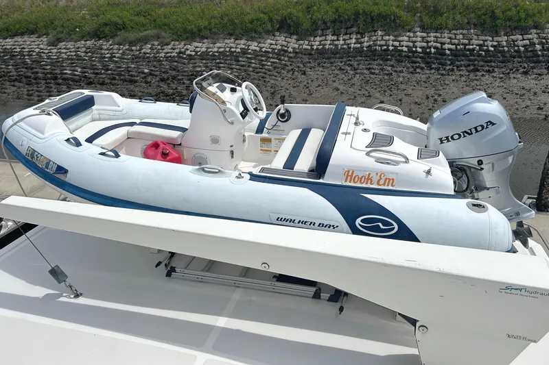 Slide: The Image of Inflatable boat with Honda motor on Grand Alaskan 60 Pilothouse, 1998 model. - 49