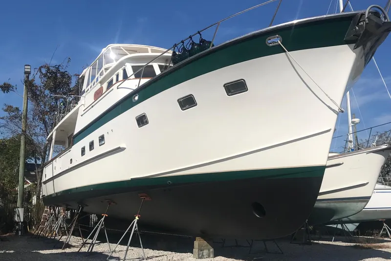 Slide: The Image of 1998 Grand Alaskan 60 Pilothouse yacht on dry dock, side view. - 6