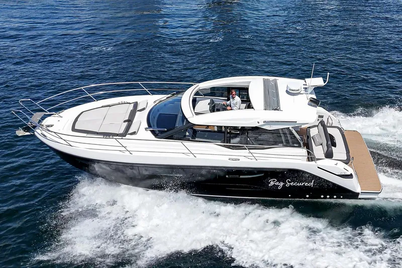 Slide: The Image of 2023 Bavaria SR36 yacht cruising on open water, showcasing sleek design and luxury features. - 19