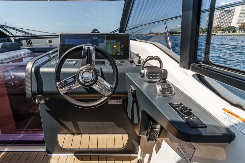Slide: The Image of Helm of 2023 Bavaria SR36 yacht with modern navigation controls and steering wheel. - 34
