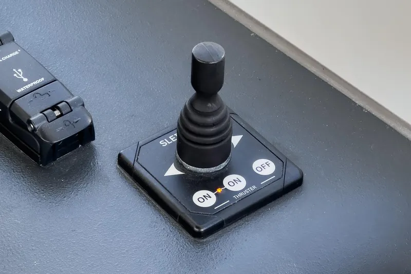 Slide: The Image of Joystick control panel on 2023 Bavaria SR36 boat dashboard. - 39