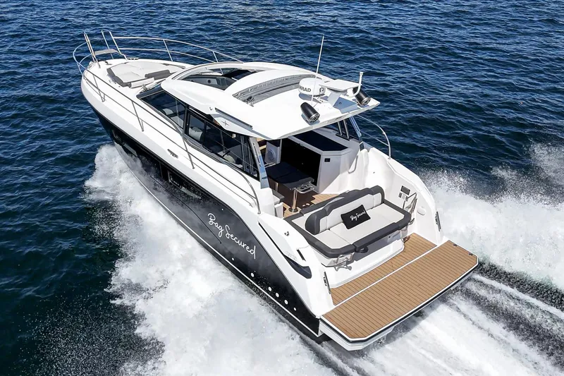 Slide: The Image of 2023 Bavaria SR36 yacht cruising on open water, showcasing sleek design and luxury features. - 6