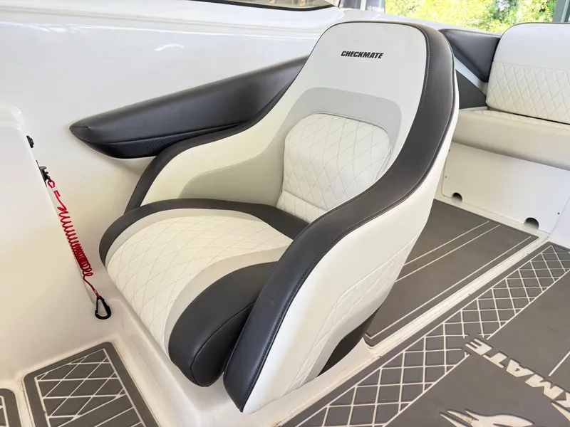 Slide: The Image of 2024 Checkmate Pulsare 2400 BRX boat interior with luxurious seating and modern design. - 11