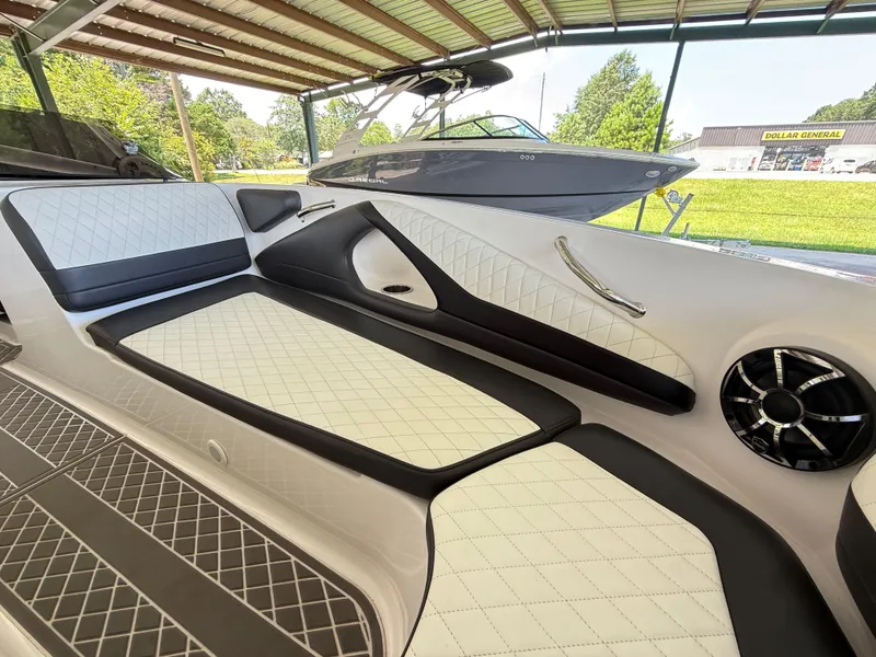 Slide: The Image of 2024 Checkmate Pulsare 2400 BRX interior with white and black quilted seating. - 17