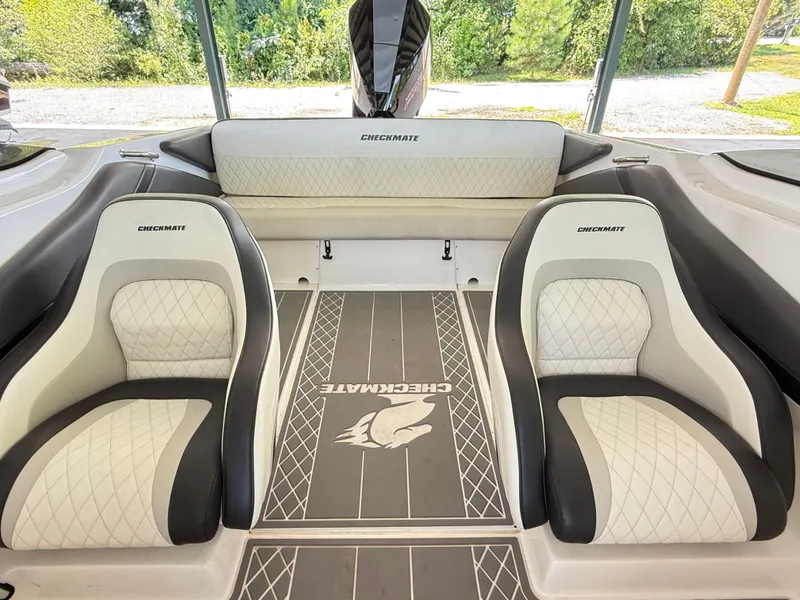 Slide: The Image of 2024 Checkmate Pulsare 2400 BRX boat interior with stylish seating and branded flooring. - 20