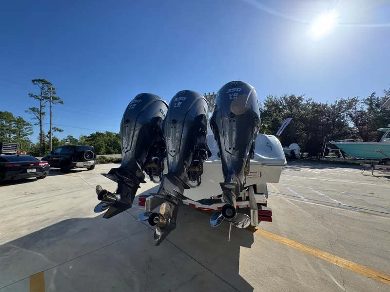 Slide: The Image of 2026 Yellowfin 36 Offshore boat with triple 350 V6 engines in a sunny outdoor setting. - 14
