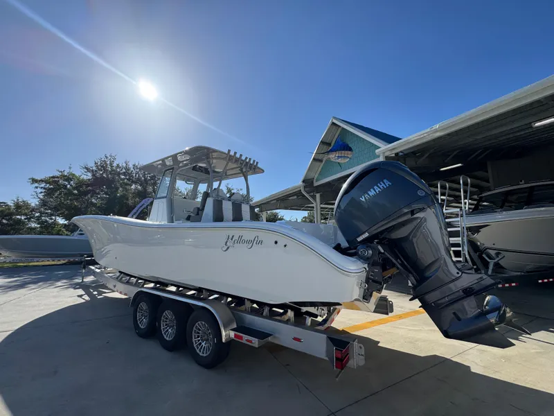 Slide: The Image of 2026 Yellowfin 36 Offshore boat with Yamaha engine on trailer under clear sky. - 17