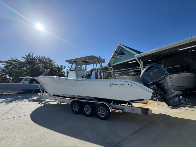 Slide: The Image of 2026 Yellowfin 36 Offshore boat on trailer under clear blue sky. - 18