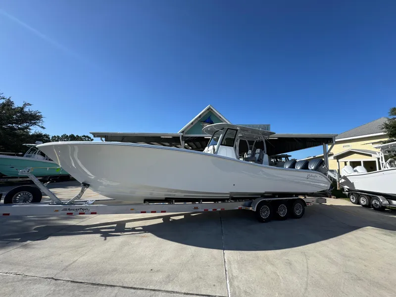 Slide: The Image of 2026 Yellowfin 36 Offshore boat on trailer under clear blue sky. - 2