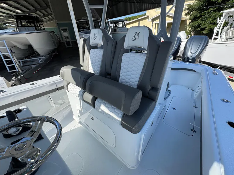 Slide: The Image of 2026 Yellowfin 36 Offshore boat interior with dual seats and steering wheel. - 32
