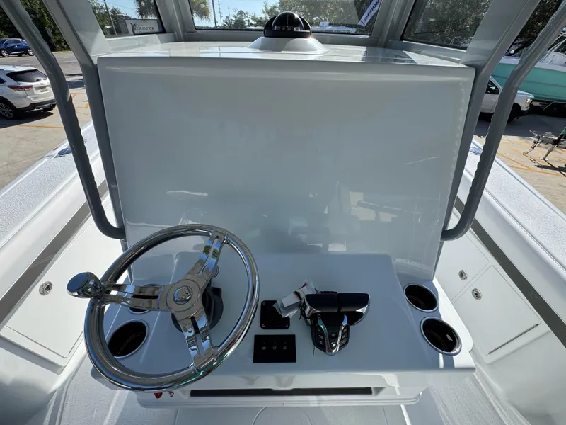 Slide: The Image of 2026 Yellowfin 36 Offshore boat helm with steering wheel and controls. - 36