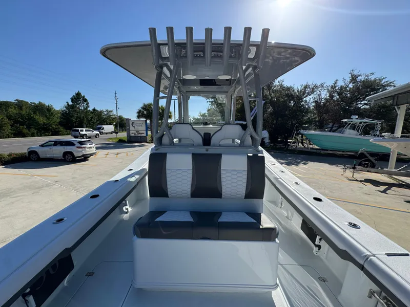 Slide: The Image of 2026 Yellowfin 36 Offshore boat with sleek seating and modern design in a sunny marina. - 39