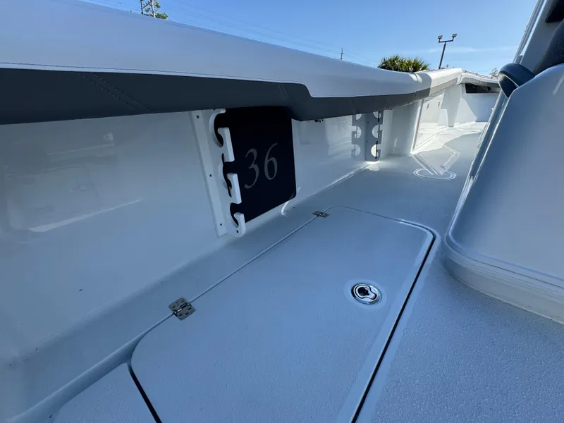 Slide: The Image of 2026 Yellowfin 36 Offshore boat interior with storage compartment and sleek design. - 40