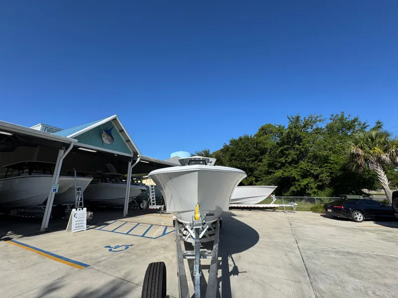 Slide: The Image of 2026 Yellowfin 36 Offshore boat on trailer in sunny outdoor setting. - 7