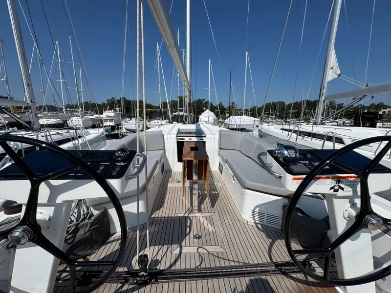Slide: The Image of 2024 Beneteau First 44 sailboat cockpit with dual steering wheels and sleek design. - 10