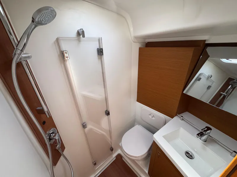 Slide: The Image of Modern bathroom in 2024 Beneteau First 44 yacht with shower, toilet, and sink. - 15