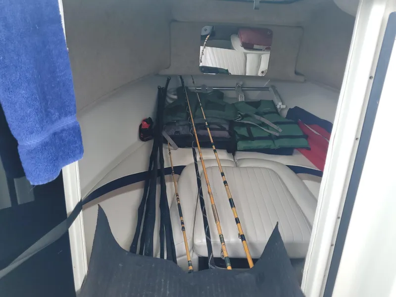 Slide: The Image of Interior of 2003 Caravelle Sea Hawk 230 with fishing rods and life jackets. - 12