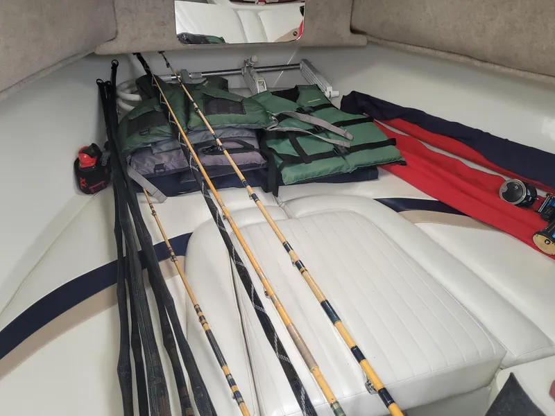 Slide: The Image of Interior of 2003 Caravelle Sea Hawk 230 with fishing gear and life jackets. - 13