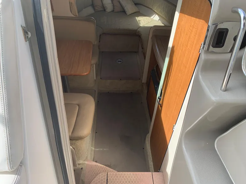 Slide: The Image of Interior view of 2006 Sea Ray 280 Sundancer cabin with seating and table. - 10