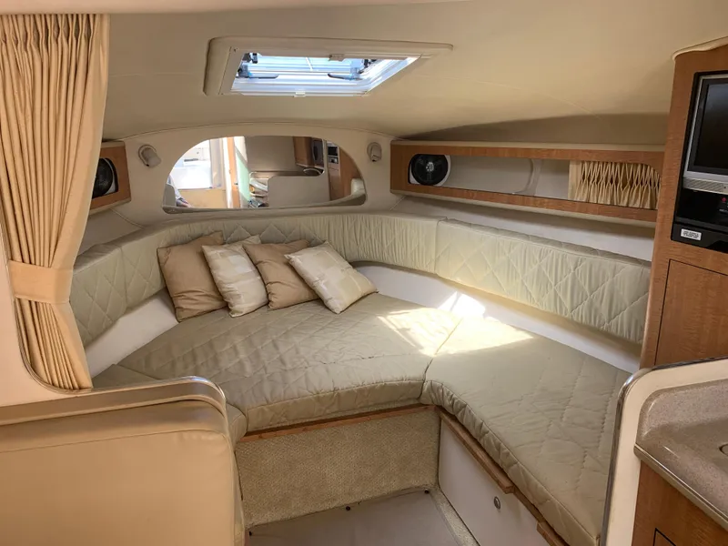 Slide: The Image of Interior of 2006 Sea Ray 280 Sundancer with cozy seating and natural light. - 11
