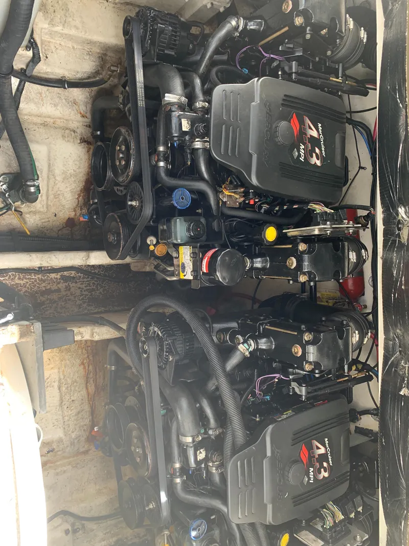 Slide: The Image of Engine compartment of a 2006 Sea Ray 280 Sundancer boat, featuring dual MerCruiser 4.3 engines. - 22