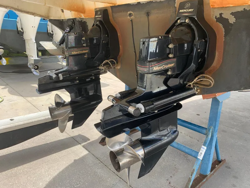 Slide: The Image of MerCruiser outdrives on a 2006 Sea Ray 280 Sundancer boat, displayed on a stand. - 25