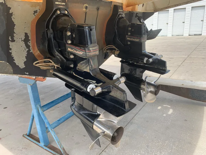 Slide: The Image of 2006 Sea Ray 280 Sundancer MerCruiser outdrives on a boat stand. - 26