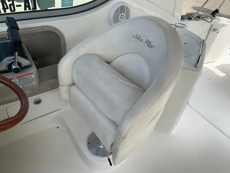 Slide: The Image of 2006 Sea Ray 280 Sundancer helm seat with steering wheel and controls. - 7