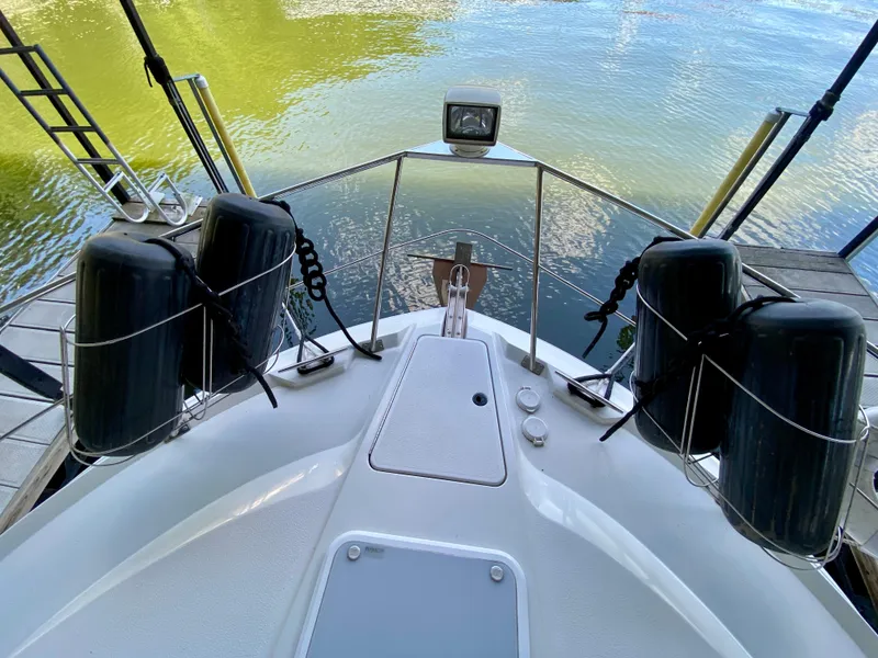 Slide: The Image of 1997 Carver 405 Motor Yacht docked in a covered marina. - 16