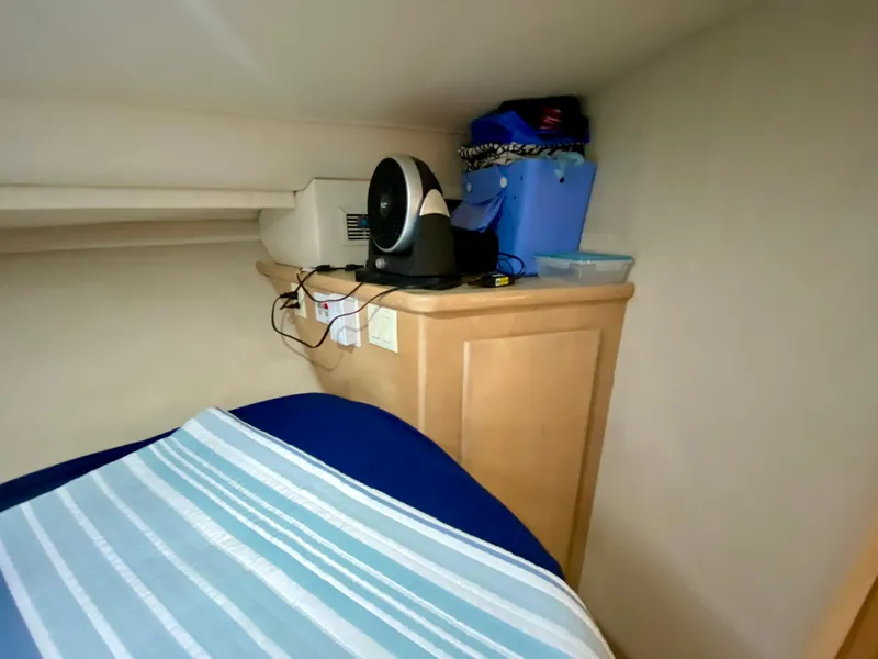 Slide: The Image of 1997 Carver 405 Motor Yacht interior with cozy dining area and beige leather seating. - 27