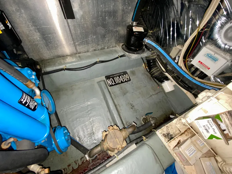 Slide: The Image of Interior of 1997 Carver 405 Motor Yacht with wooden cabinetry and carpeted stairs. - 35