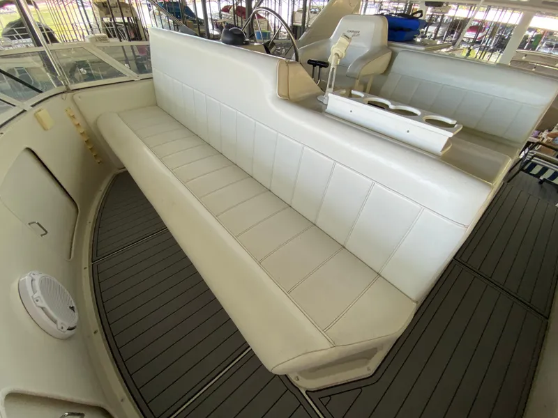 Slide: The Image of 1997 Carver 405 Motor Yacht, sleek design with reflective surface, docked by the water. - 13