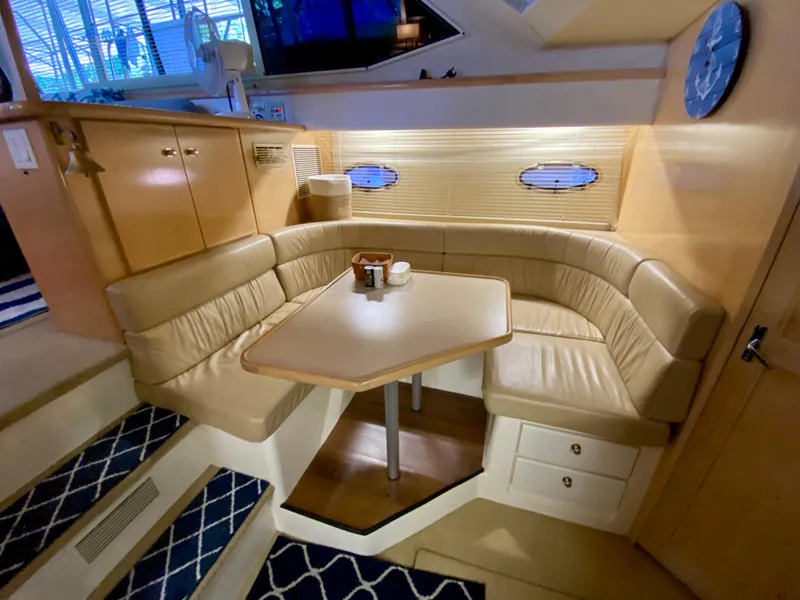 Slide: The Image of 1997 Carver 405 Motor Yacht kitchen with appliances, sink, and cabinetry. - 25