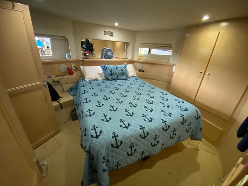 Slide: The Image of 1997 Carver 405 Motor Yacht interior with cozy dining area and leather seating. - 29