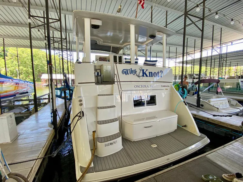 Slide: The Image of 1997 Carver 405 Motor Yacht docked, featuring rear deck and steps, Osceola, IA. - 3