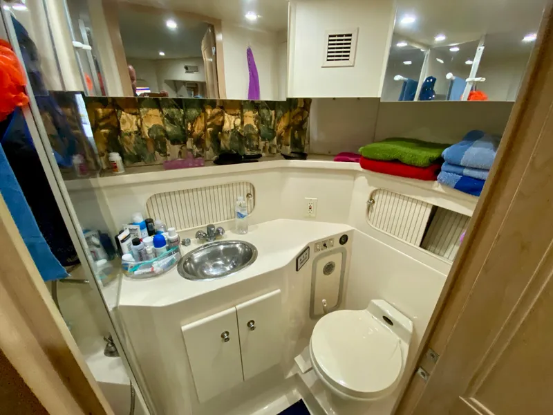 Slide: The Image of Cozy interior of 1997 Carver 405 Motor Yacht with wooden cabinet and bed. - 32