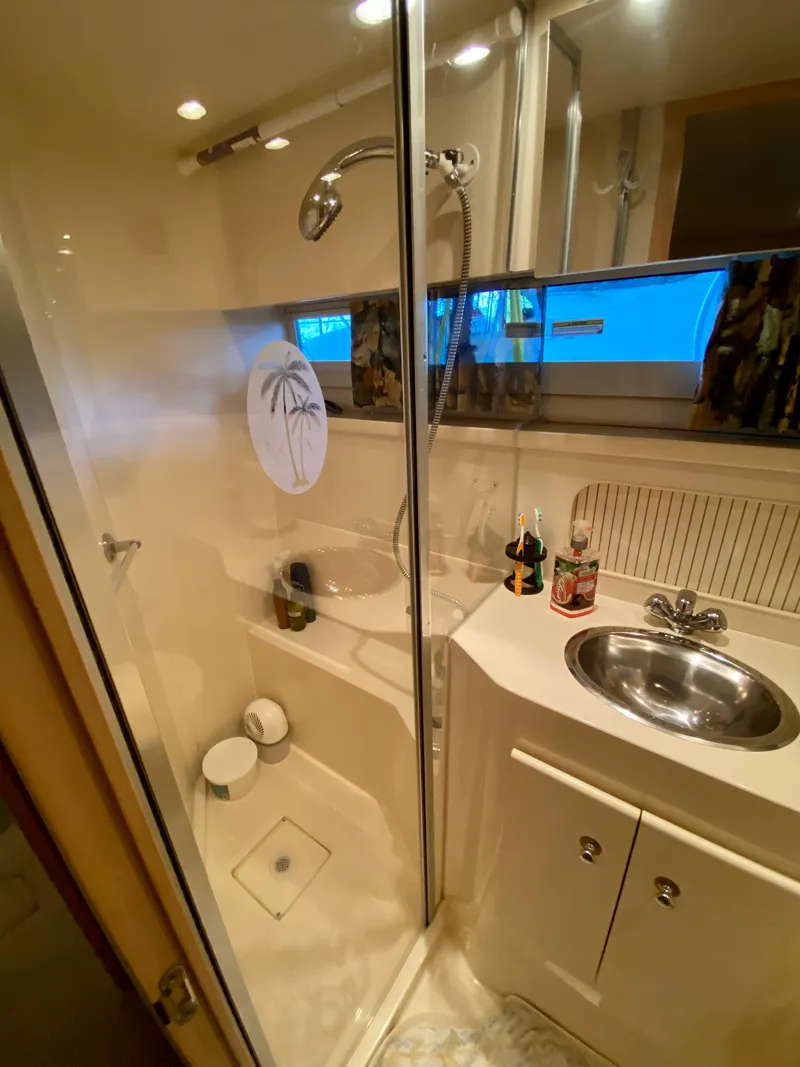 Slide: The Image of Bathroom interior of 1997 Carver 405 Motor Yacht with toilet and sink. - 33