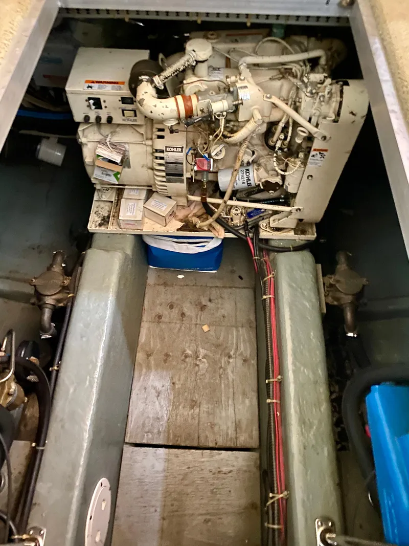 Slide: The Image of 1997 Carver 405 Motor Yacht bathroom with toilet, sink, and storage cabinet. - 34