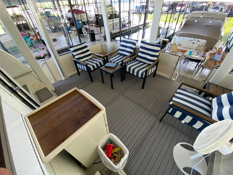 Slide: The Image of 1997 Carver 405 Motor Yacht interior with fridge, steps, and anchor-themed mat. - 7