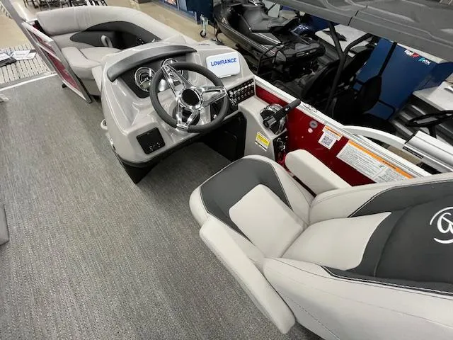 Slide: The Image of 2025 Barletta ARIA 20QC boat interior with steering wheel and seating. - 20