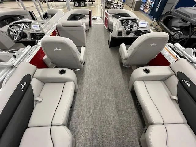 Slide: The Image of 2025 Barletta ARIA 20QC pontoon boat interior with plush seating and modern dashboard. - 8